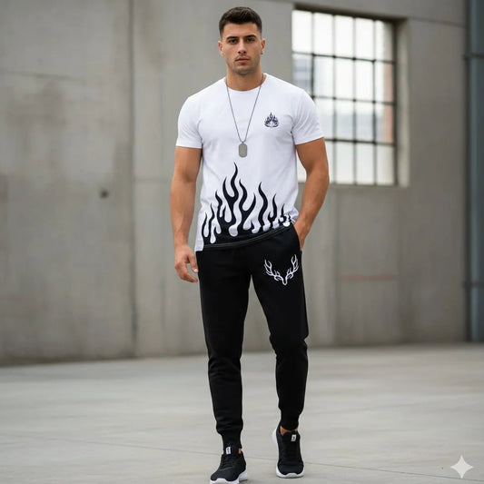 Man wearing a white t-shirt with flame design and black pants in an urban setting