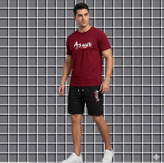 Man wearing a red t-shirt and black shorts with a brand logo against a grid background