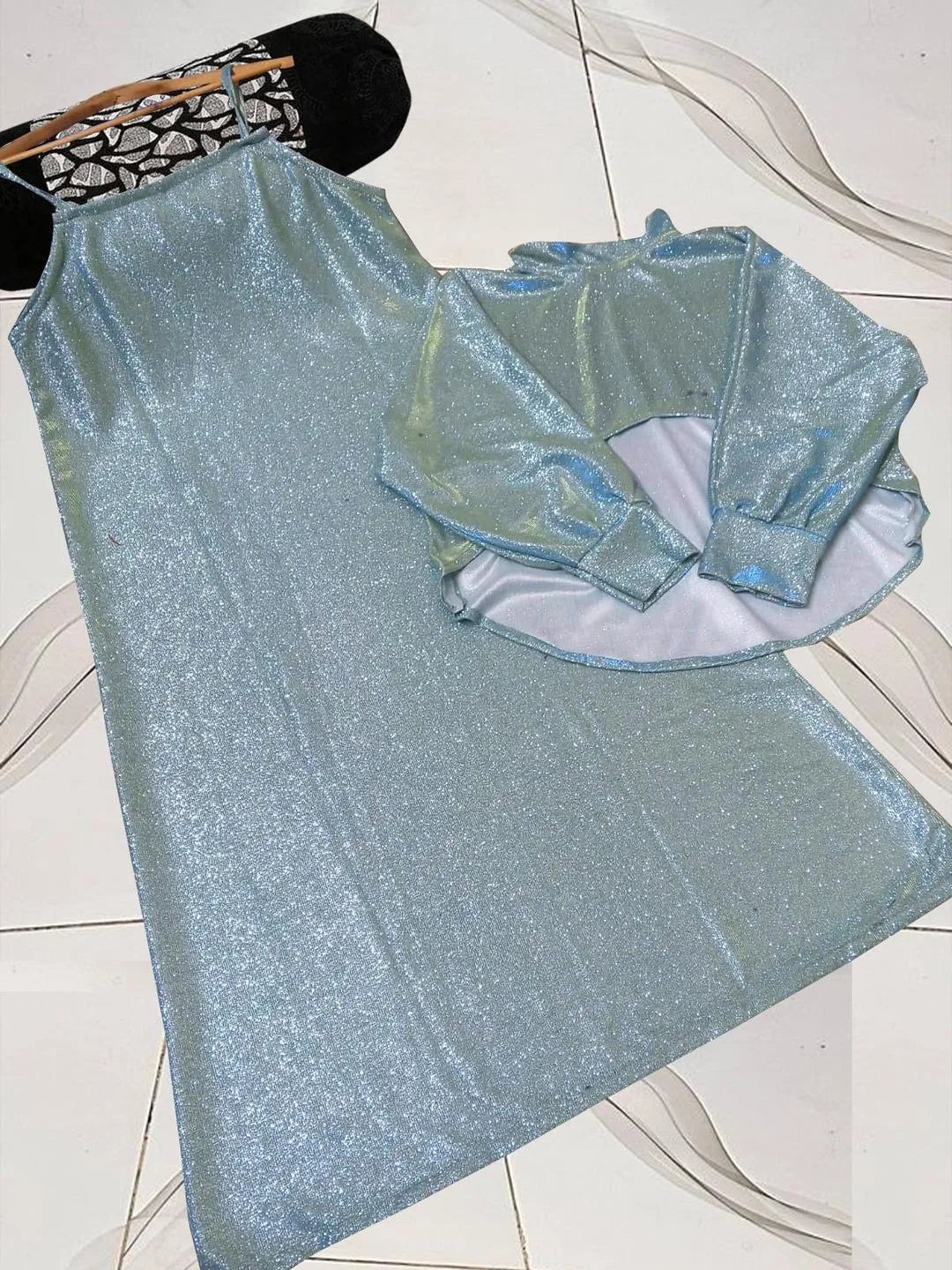 Shiny blue top on a white tiled floor