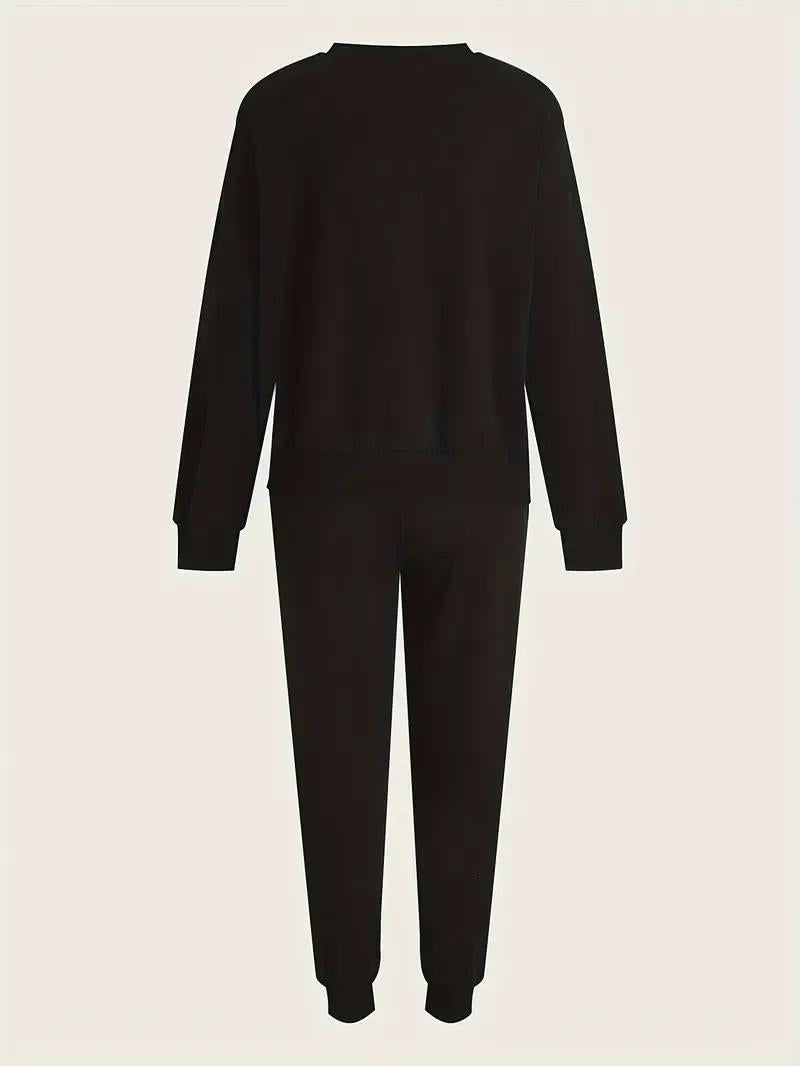 Black onesie on a beige background