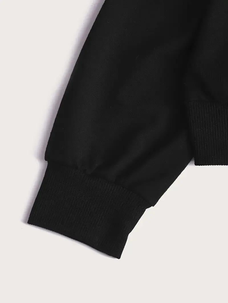 Close-up of a black sleeve on a light gray background