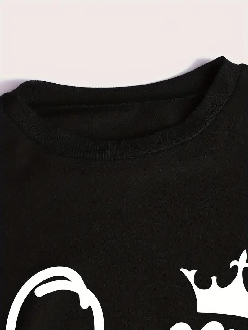 Black shirt with white graphic design on a white background
