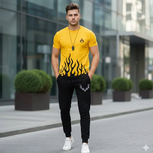 Man wearing a yellow t-shirt with flame design and black pants in an urban setting